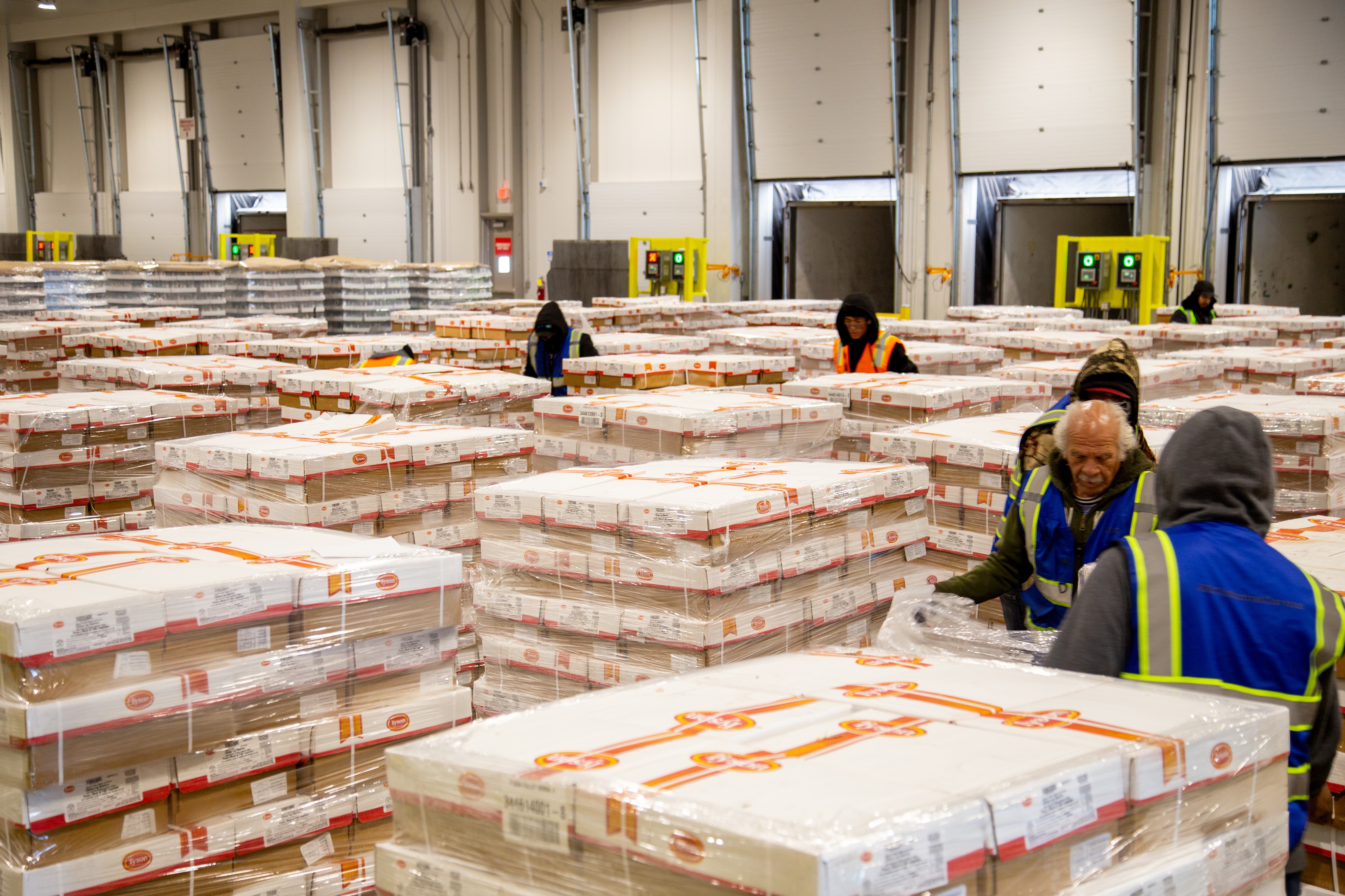 Palletized refrigerated product staged across a controlled dock operation.